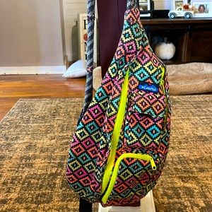 Florescent and black Kavu sling.